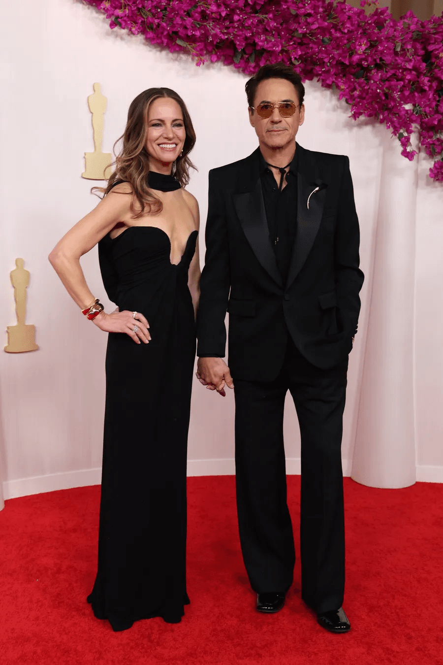 Susan Downey and Robert Downey Jr. wearing Saint Laurent and Tiffany & Co.